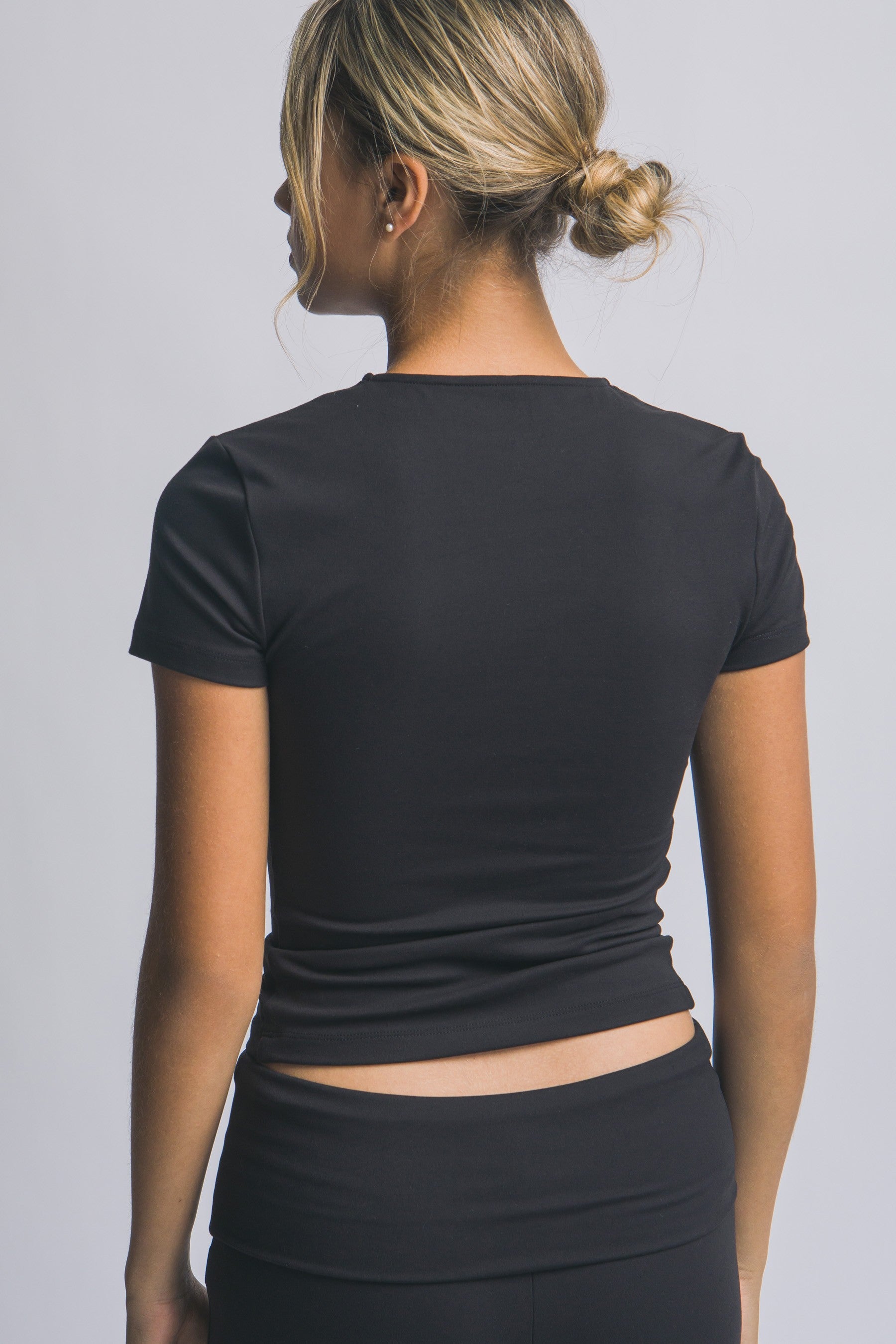 Blusa deportiva de manga corta con ajuste stretch