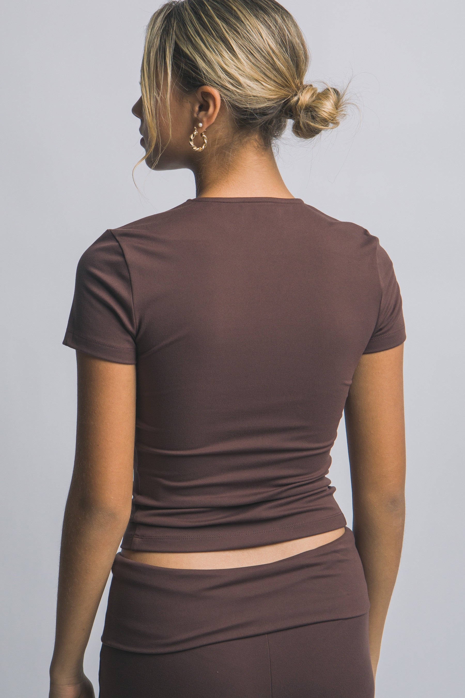 Blusa deportiva de manga corta con ajuste stretch