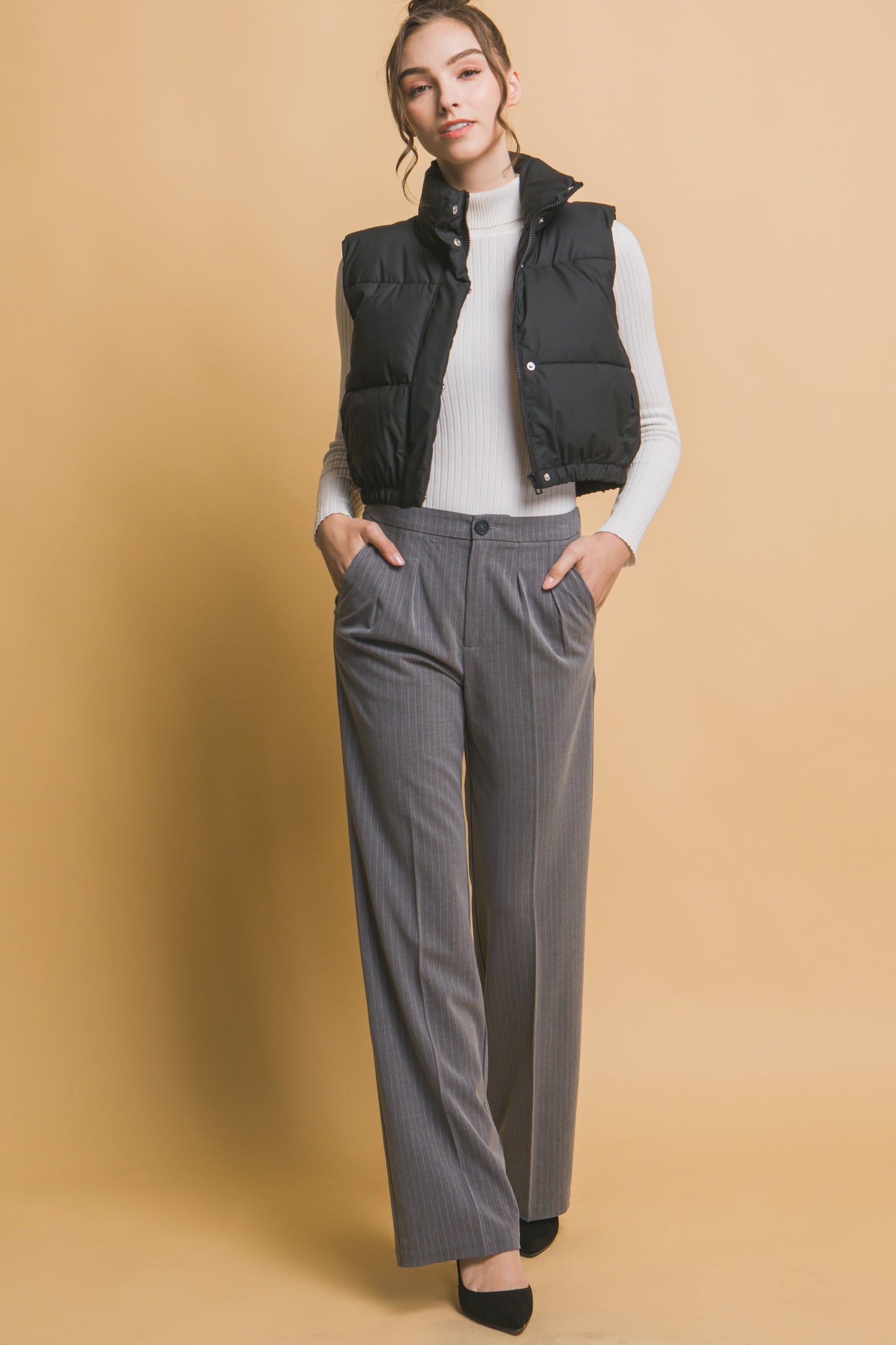 Chaleco acolchado con cuello alto y ajuste en cintura