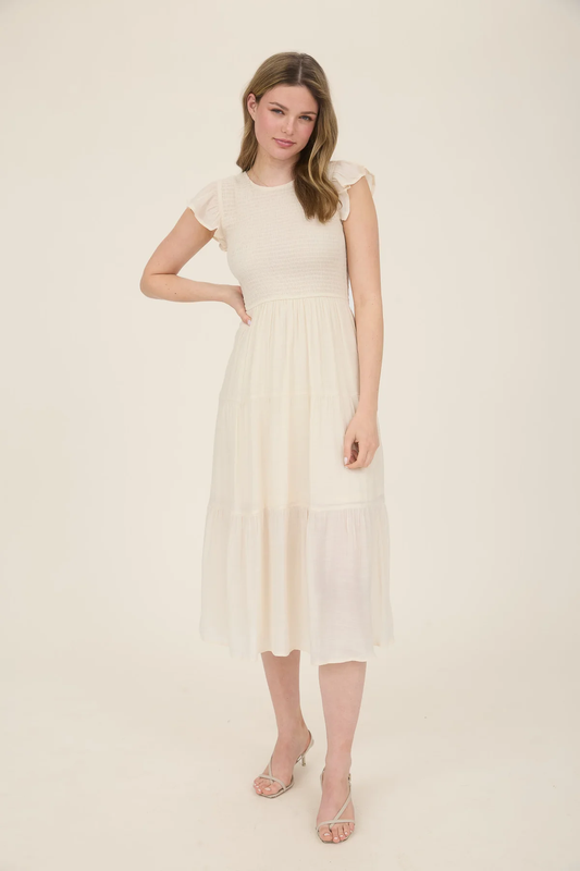 Vestido midi con olanes y smock en busto